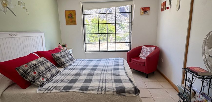 Parcela 6.438 m² La Campana Valle de Elqui, con luz y agua, construcción de ladrillo, piscina y frutales.
