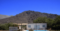 Parcela 6.438 m² La Campana Valle de Elqui, con luz y agua, construcción de ladrillo, piscina y frutales.